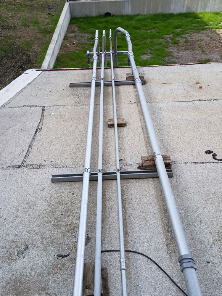 Conduit runs on a rooftop at an industrial site